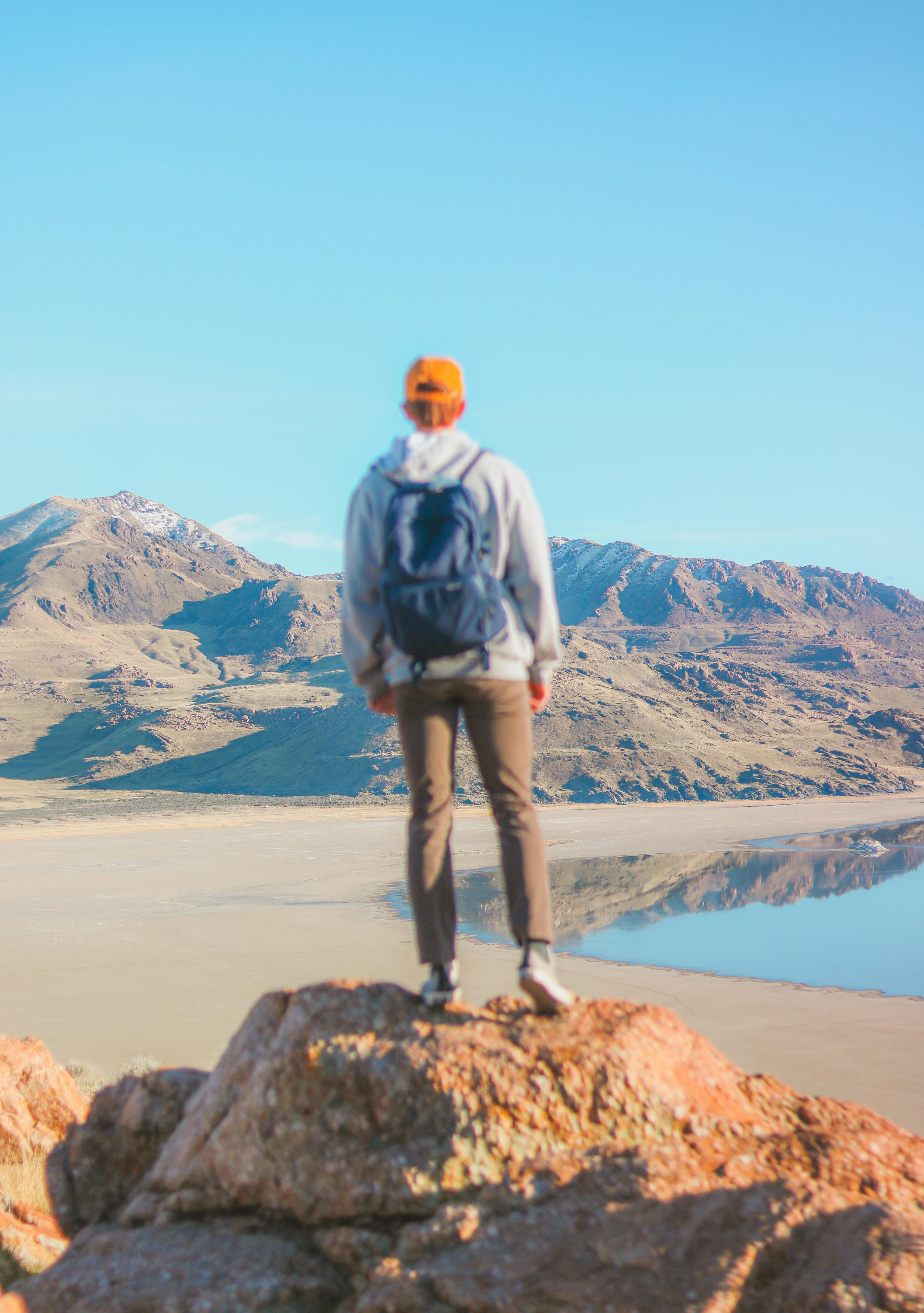 Picture of person staring out at the future horizon and stepping forward